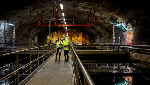 Experts from Sweco discussing water engineering in a tunnel underground