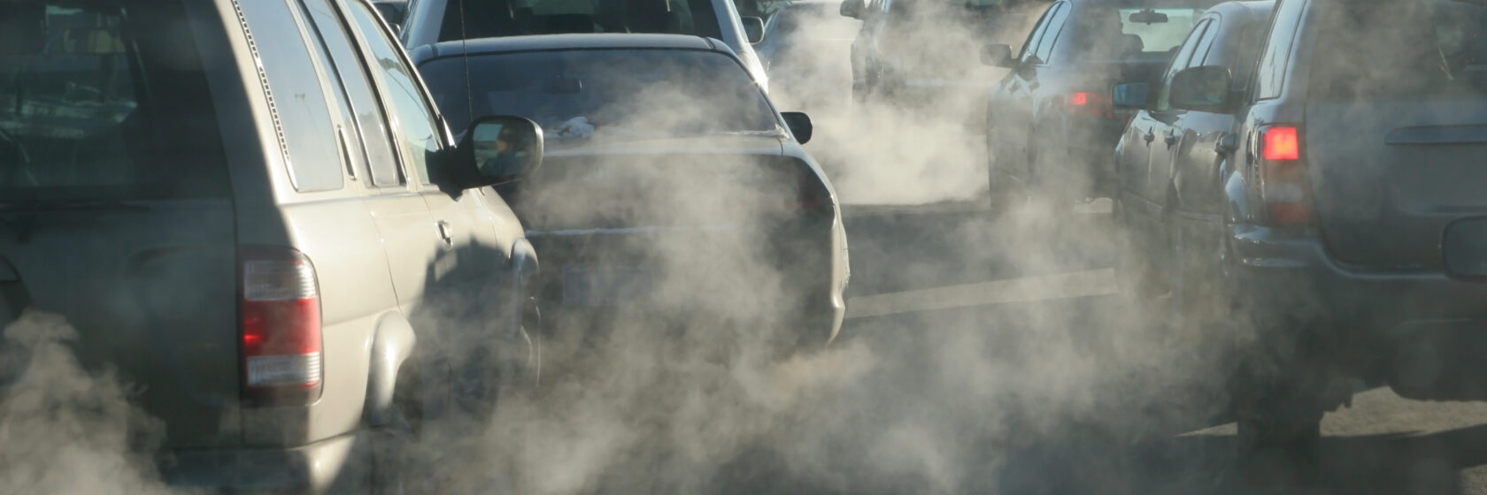 Traffic with car queues and polluting clouds