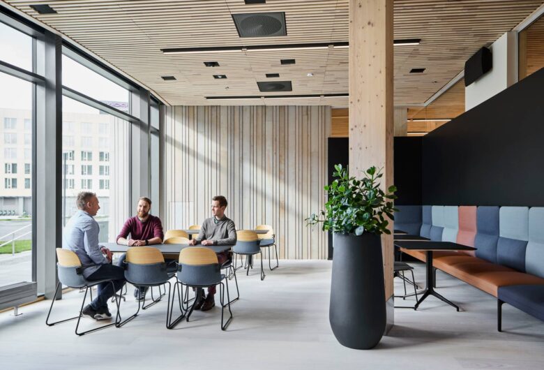 people meeting sitting by a table