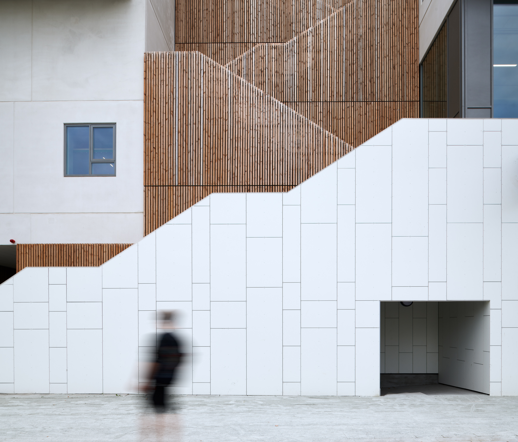 A person in front of the stairs in a new housing area