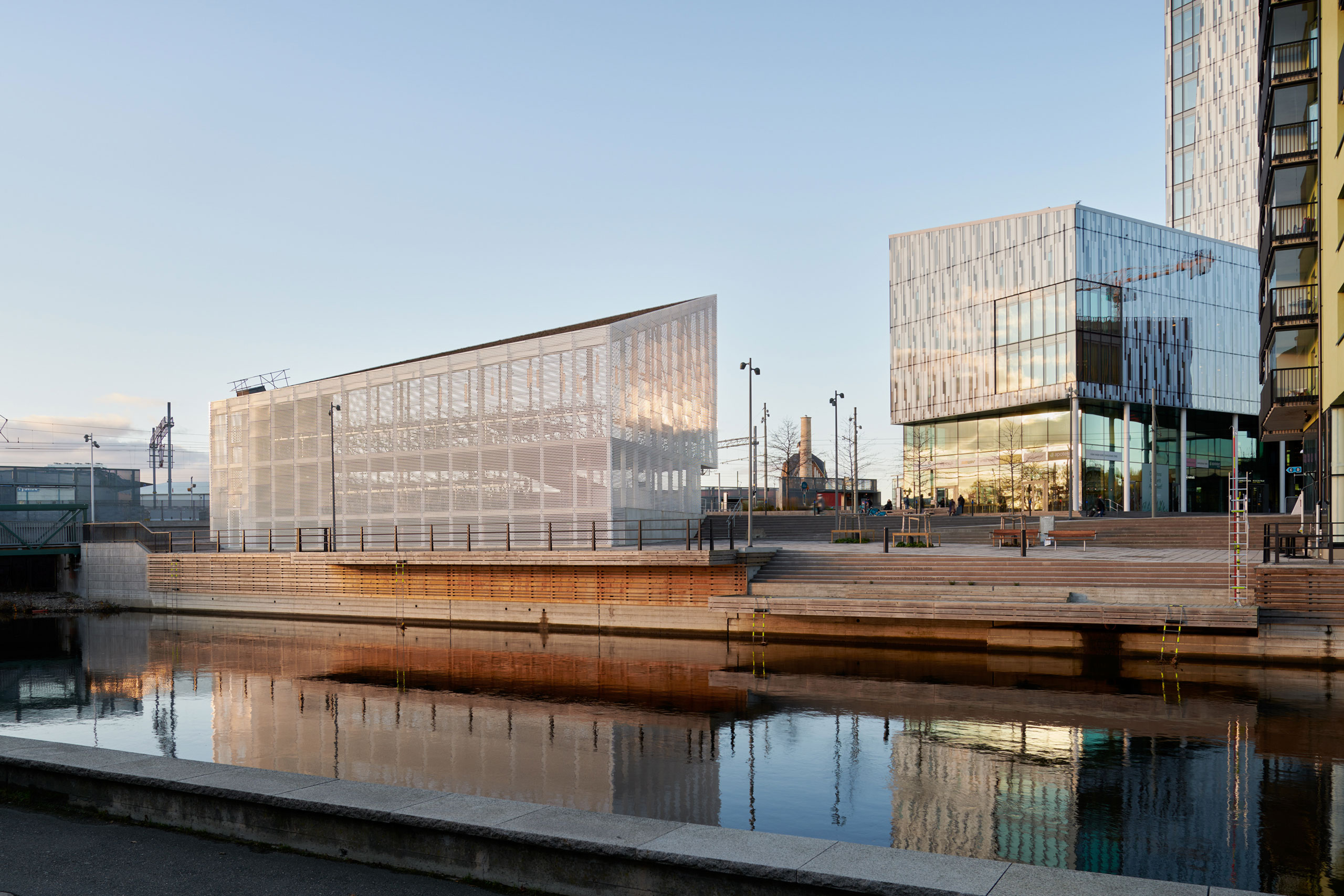 A building dedicated to bicycle parking seen from the water