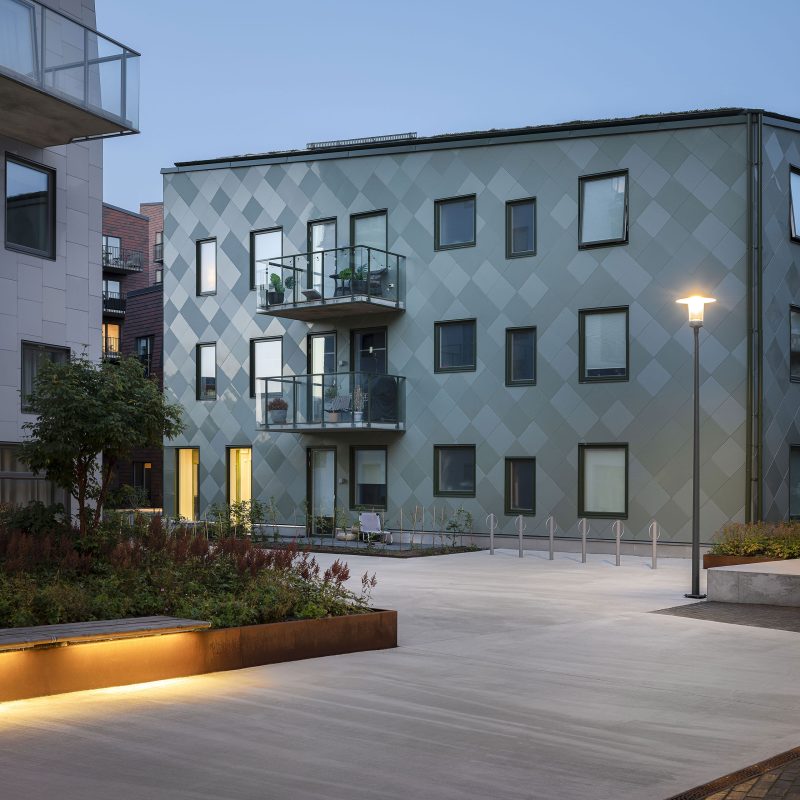 A grey house with two balconys