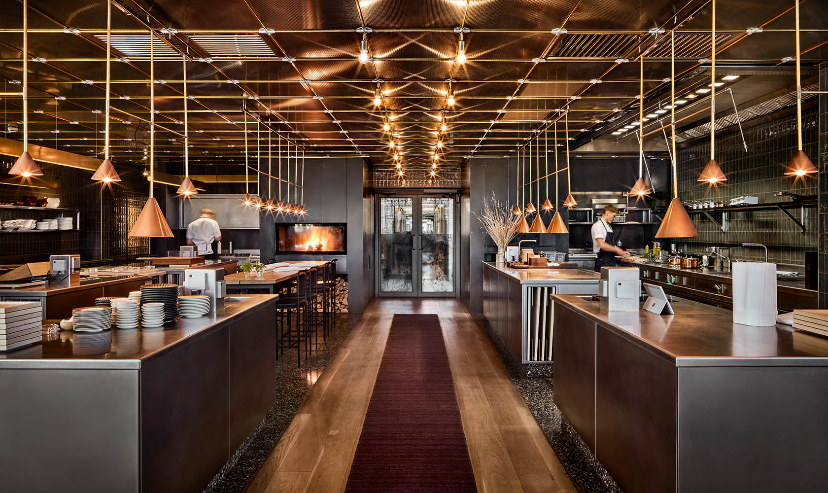 Modern restaurant kitchen with beautiful lighting design.