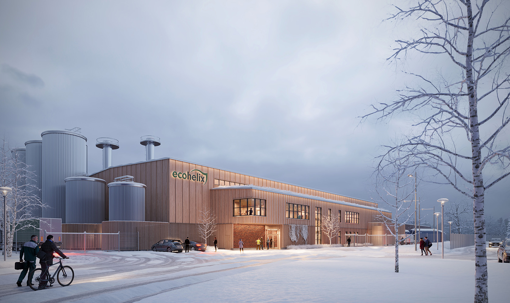 Visualization showing a winter scene of an industrial building in light wood with gray silos on the left. A lower section with windows extends along the long side of the building. In front of the building, there is a road with a few birch trees on the side.