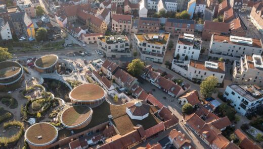 An aerial view of Odense showing the cityscape with buildings of various shapes.