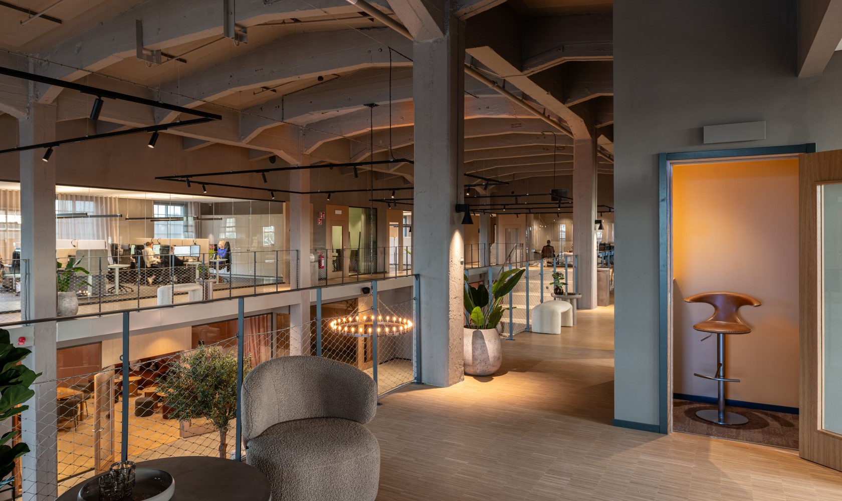 View from the upper level with workstations and a view over the larger lounge area on the lower level.