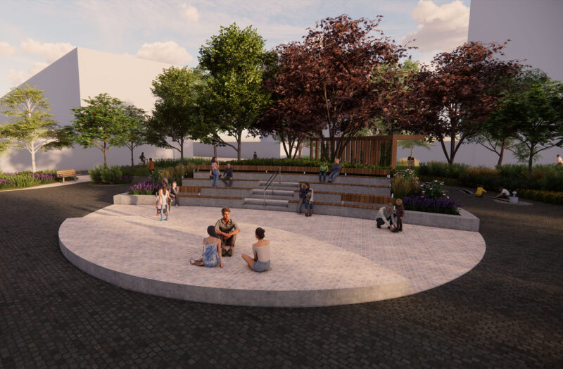 Visualization of an open area with a round elevated stage made of stone material, and behind it, terraced spectator seats surrounded by greenery.