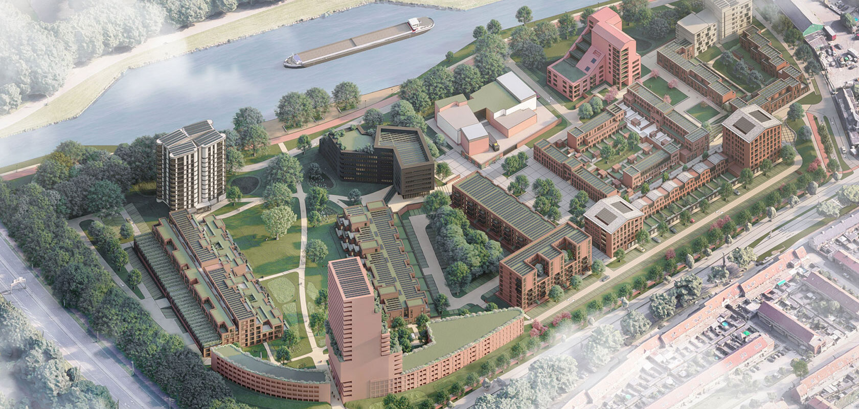 Aerial view of modern urban development featuring buildings, green spaces, and a river with a barge.