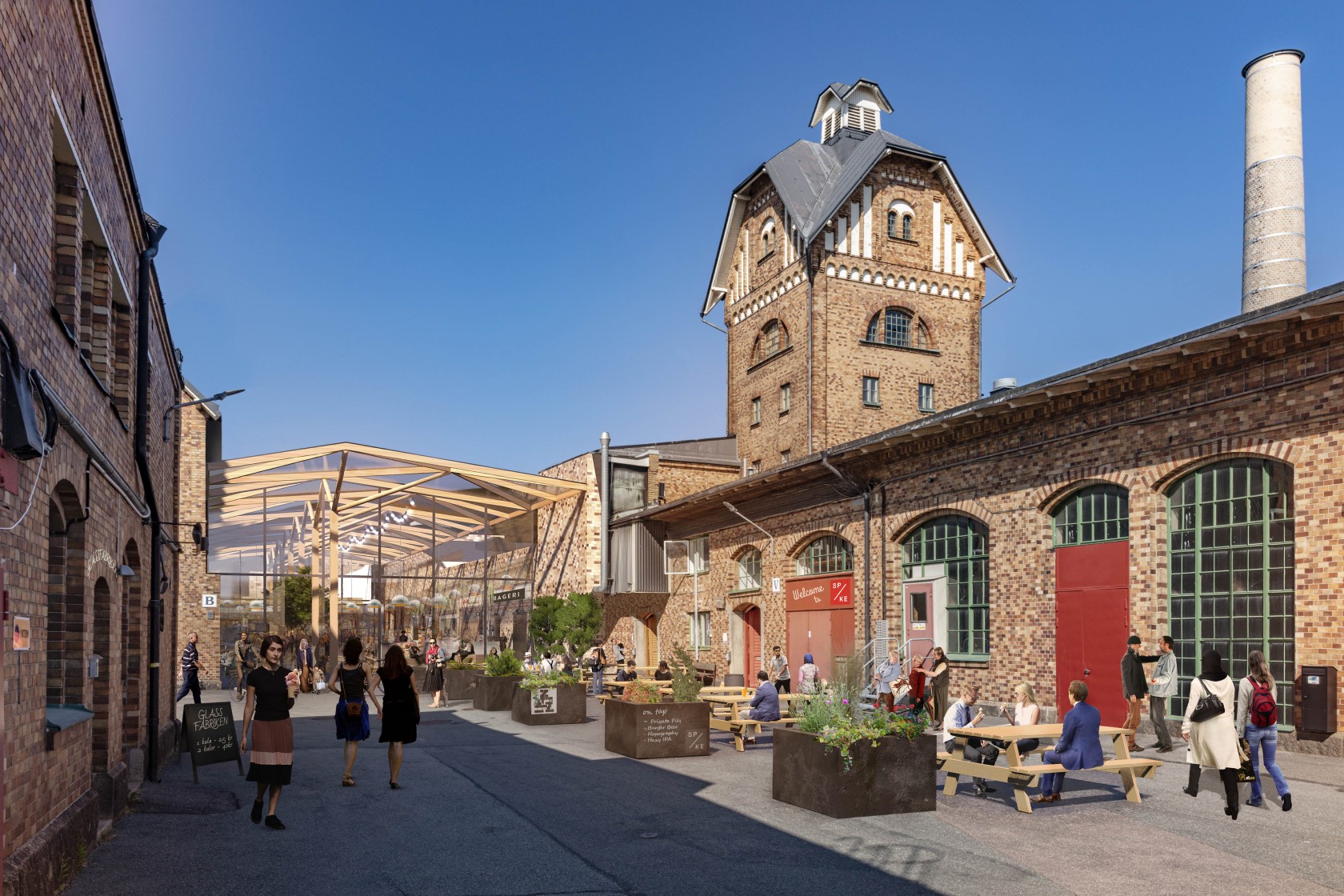 Historic brick factory turned community space with people dining and walking under a sunny blue sky.