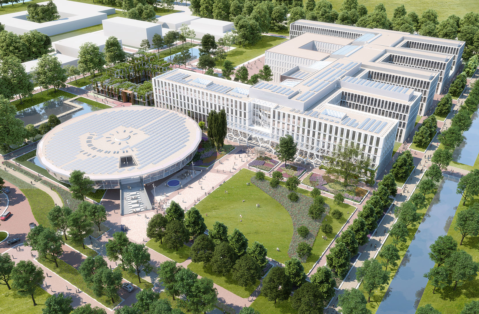 Modern urban campus with circular and rectangular buildings, solar panels, green spaces, and water bodies.