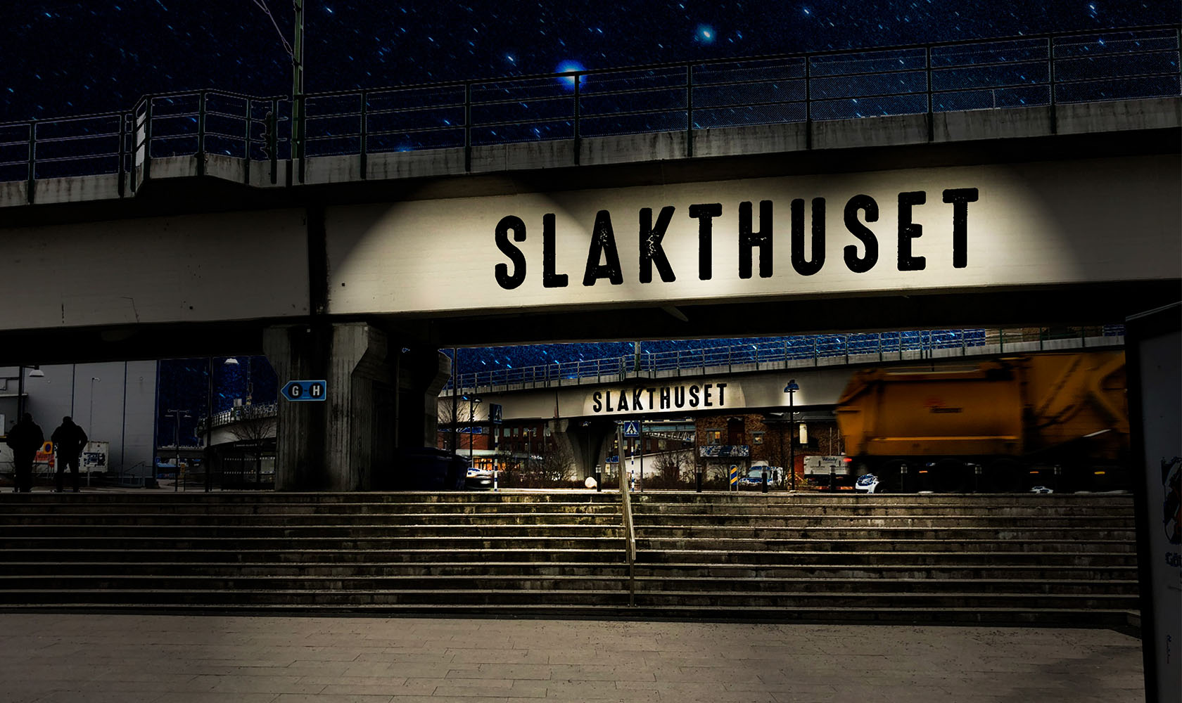 Nighttime view of Slakthuset bridge with pedestrian walkway and stairs.