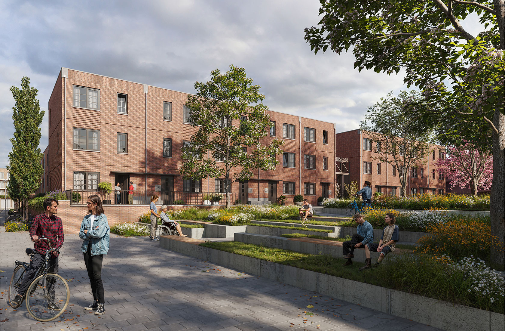 Modern brick apartment buildings with outdoor courtyard and people socializing in landscaped area.