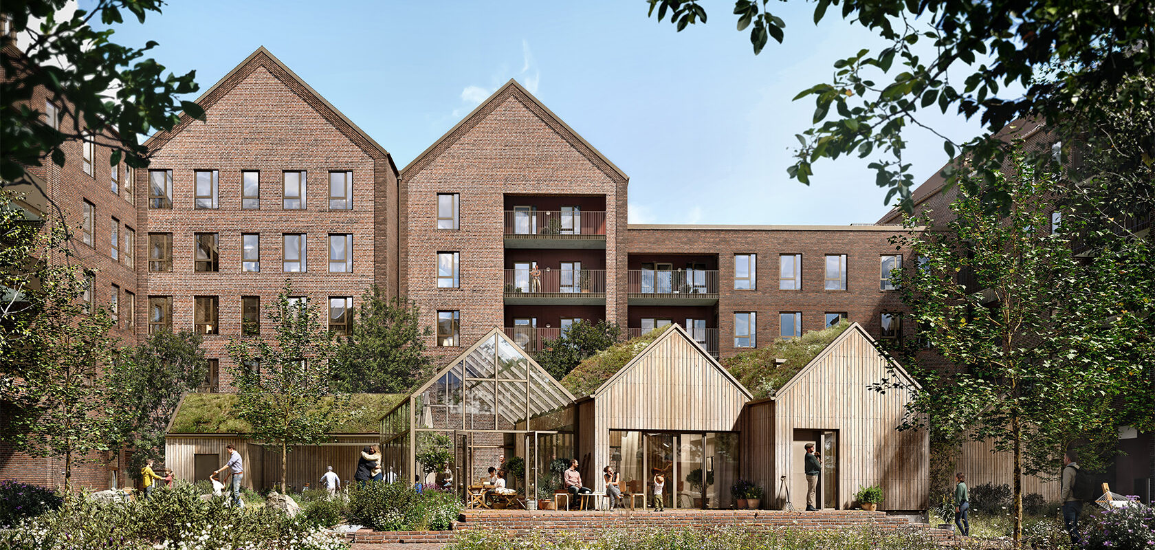 Modern apartment buildings with large windows and a communal garden area in front.