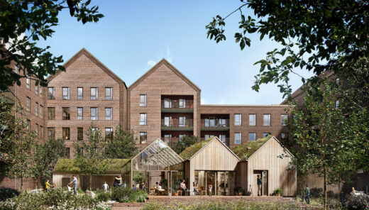 Modern apartment buildings with large windows and a communal garden area in front.