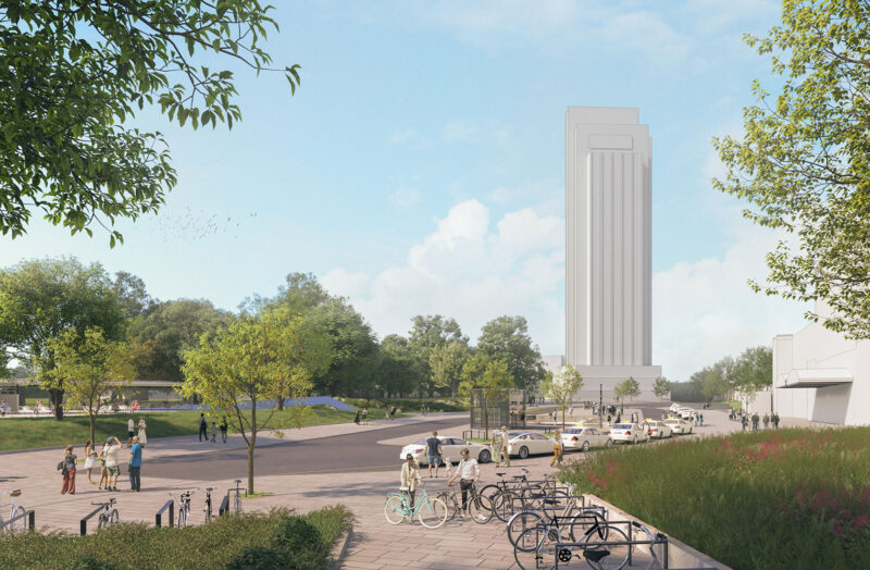 Modern skyscraper and park with people and parked bicycles, under a bright blue sky.
