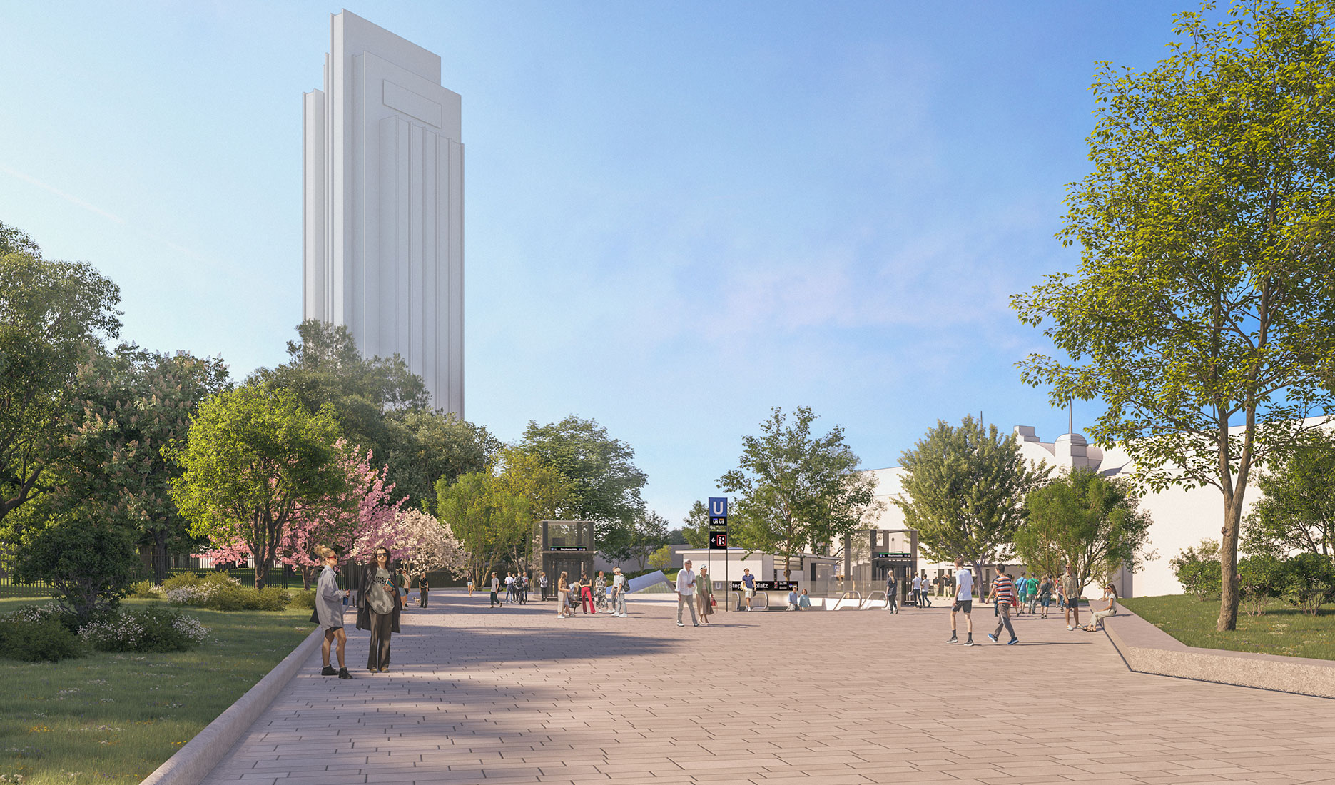 People strolling in a park with trees, a tall white building, and entrance to an underground metro station.