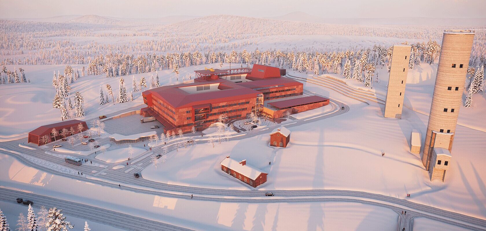 Modern red hospital building in snowy forest landscape with tall observation towers and access roads