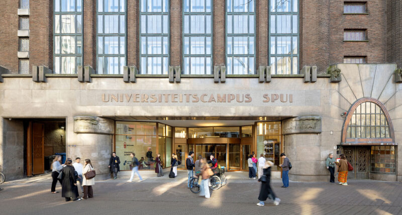 University campus Spui building entrance with students and bicycles