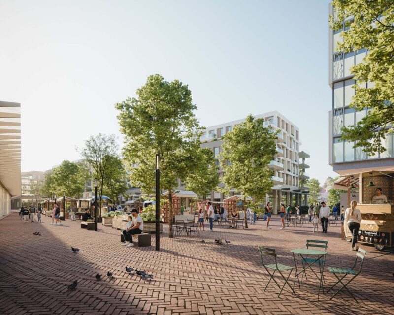 Sunny urban plaza with market stalls, outdoor seating, trees, and modern apartments
