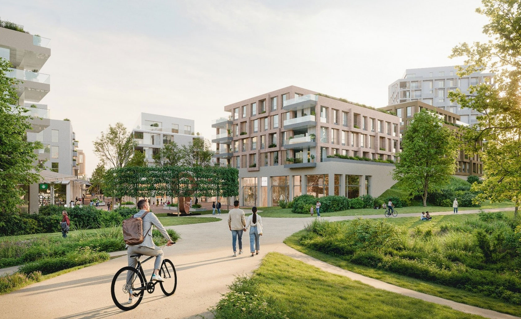Modern apartment complex with park, walking paths, and cyclist in green urban neighborhood